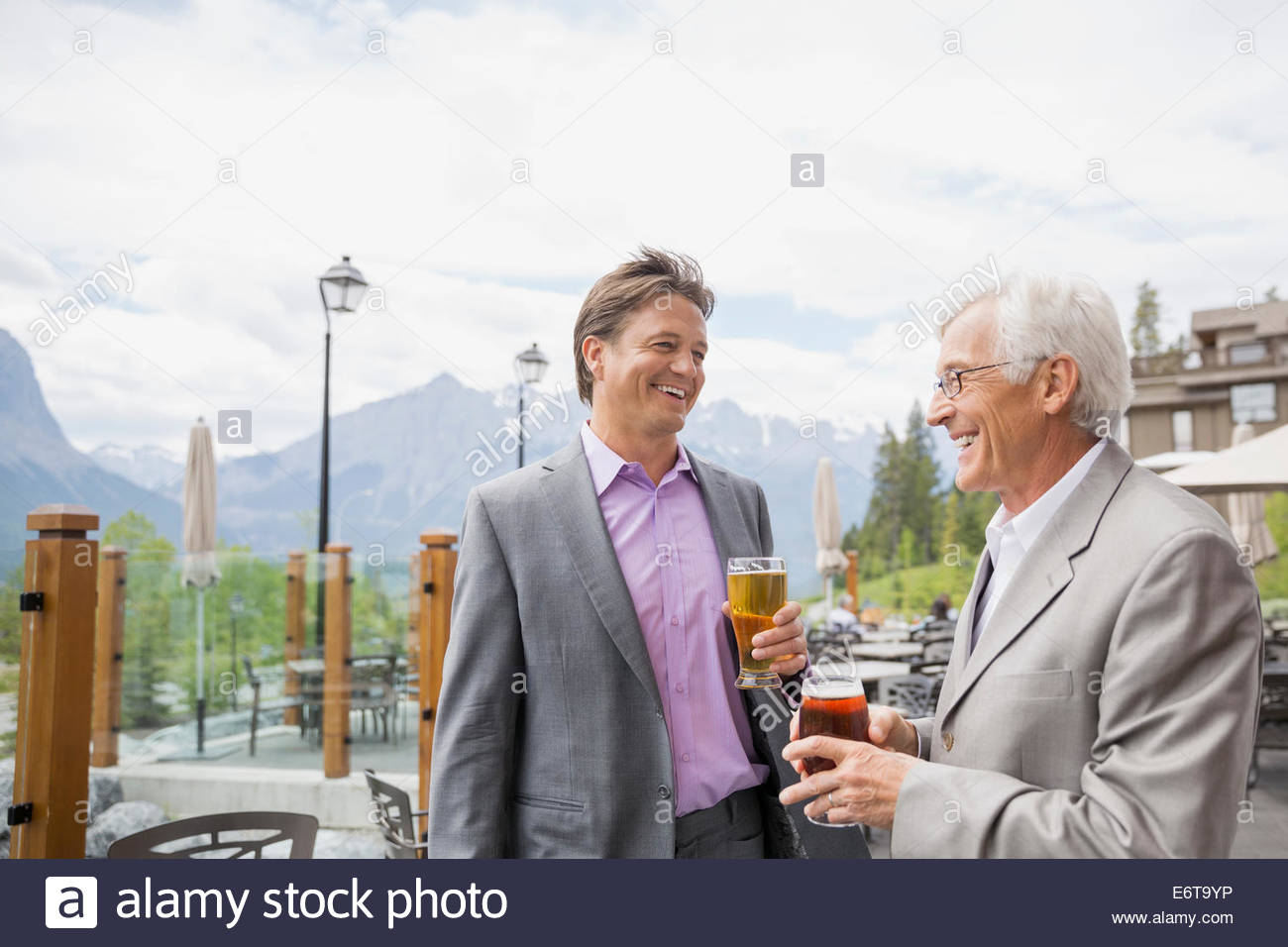 Businessmen talking at networking event Stock Photo