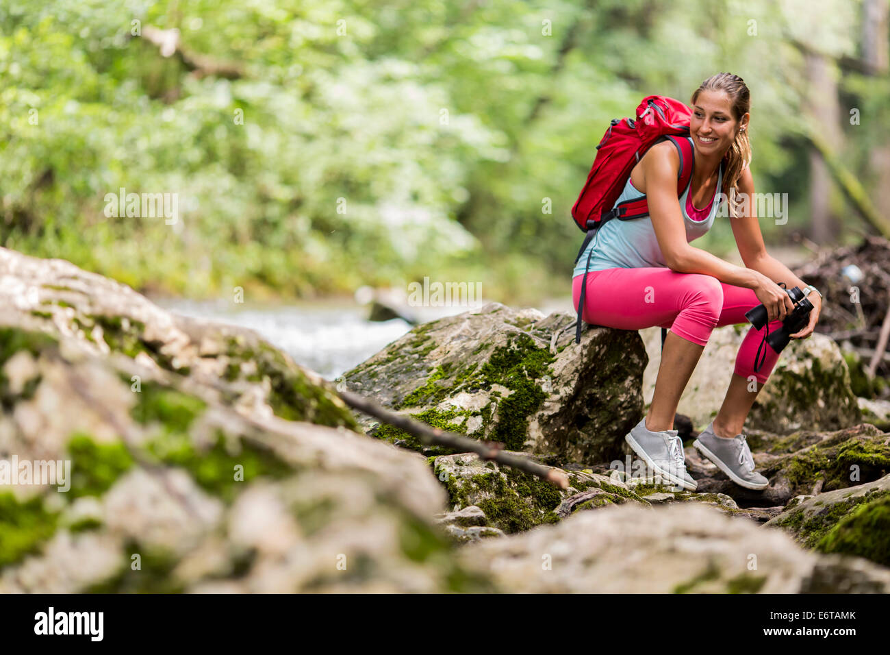 Young woman hiking in the forest Stock Photo - Alamy