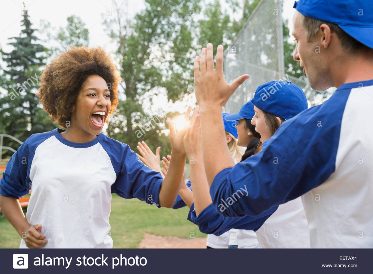 Baseball team high filing on field Stock Photo