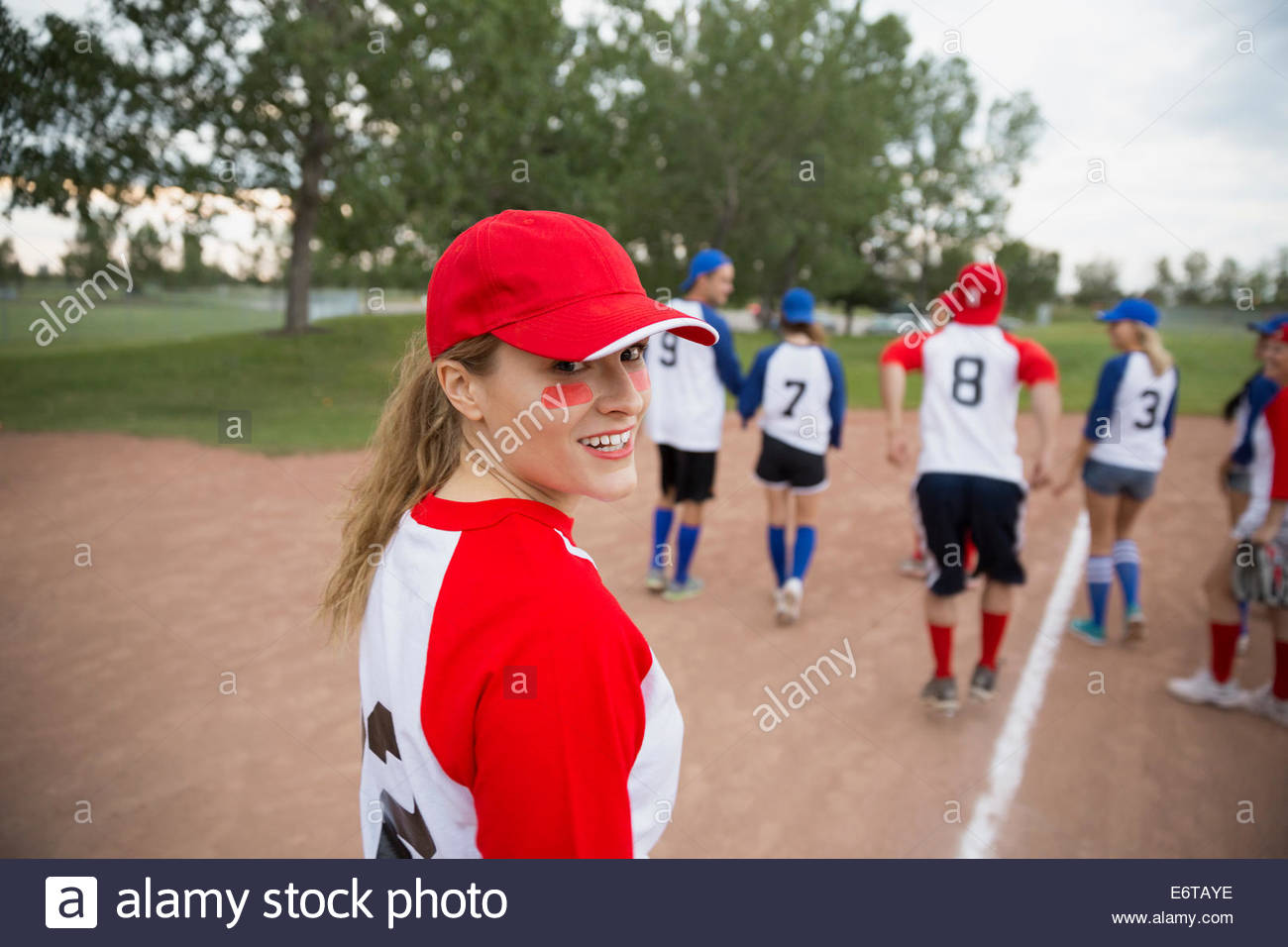 Baseball player walking with teams on field Stock Photo Alamy