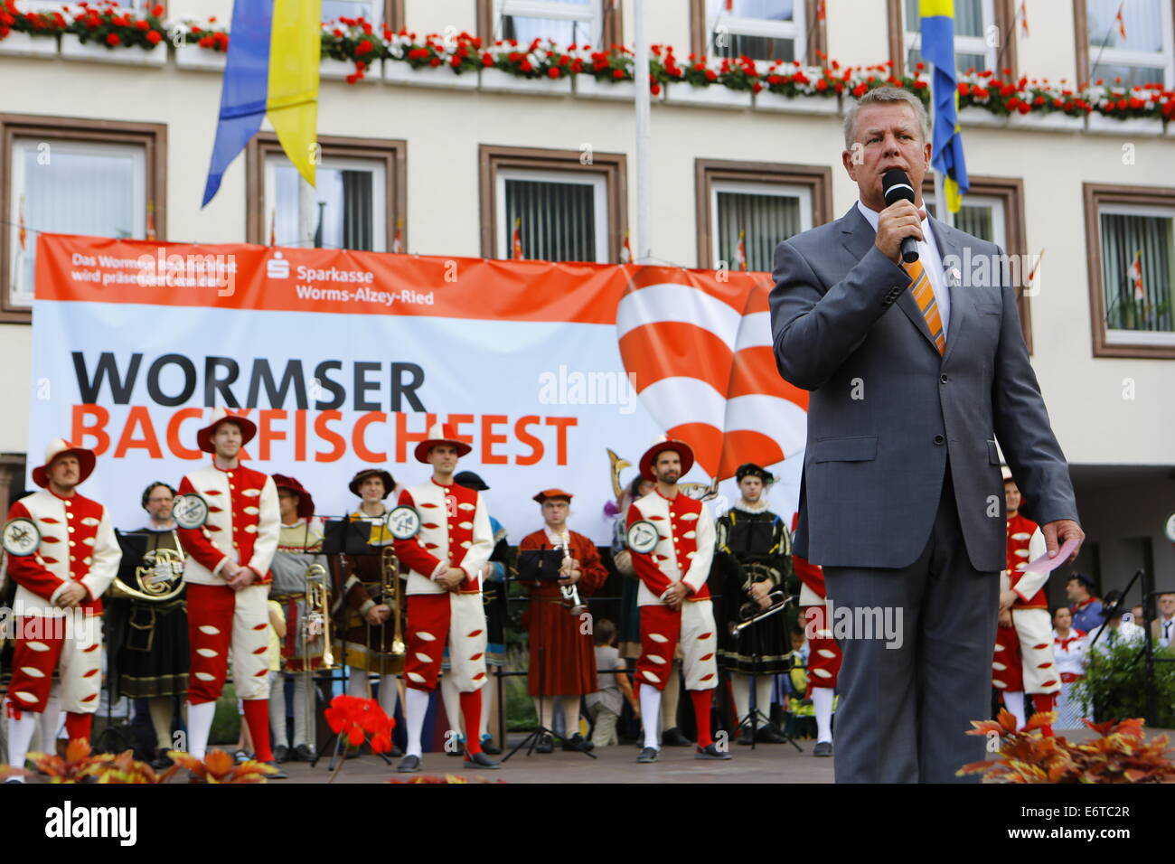 Worms, Germany. 30th August 2014. The Lord Mayor of Worms, Michael Kissel (SPD), addresses the opening ceremony of the Backfischfest 2014. The largest wine fair along the Rhine, the Backfischfest, started in Worms with the traditional handing over of power from the Lord Mayor to the mayor of the fishermenÕs lea. The ceremony included dances and music. Stock Photo