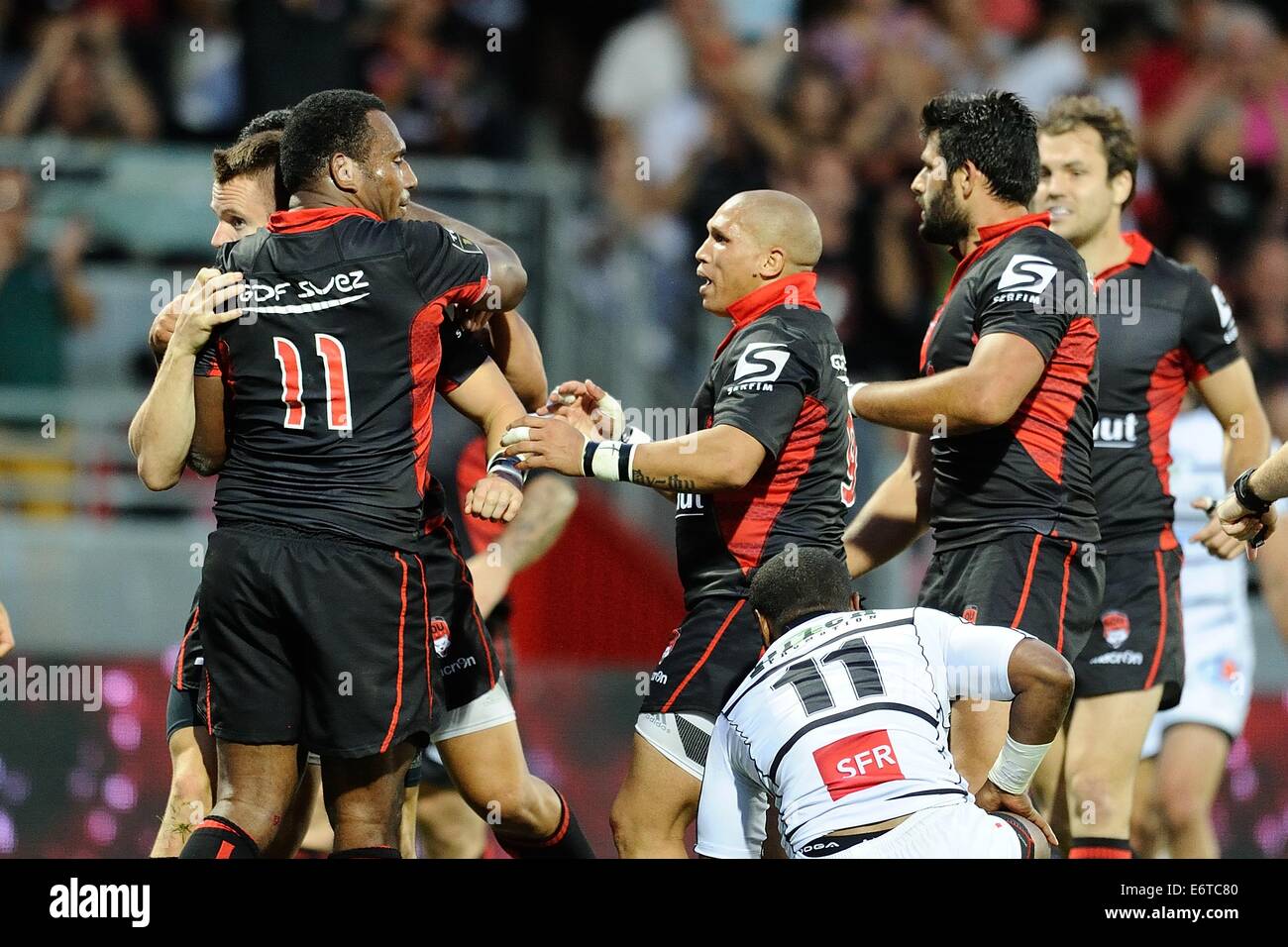 Lyon, France. 30th Aug, 2014. French TOP 14 rugby union. Lyon Olympique Universitaire versus Brive. Toby Arnold (lou) celebrates with team mates for a try Credit:  Action Plus Sports/Alamy Live News Stock Photo