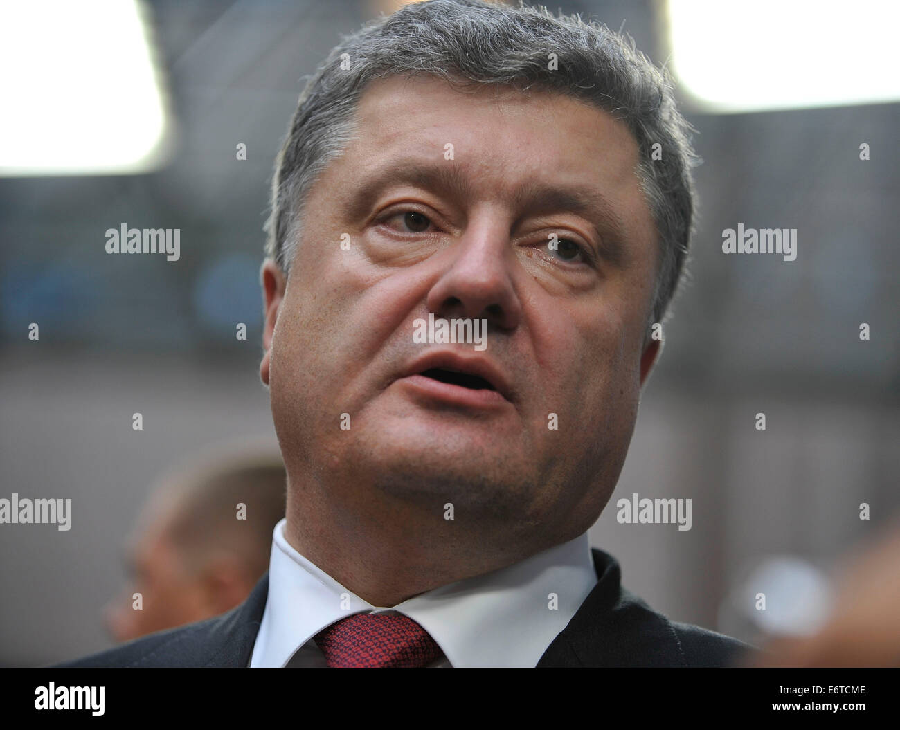 Brussels, Belgium. 30th Aug, 2014. Ukrainian President Petro Poroshenko leaves European Council headquarters after addressing an European Union(EU) special summit in Brussels, Belgium, Aug. 30, 2014. Ukrainian President Petro Poroshenko said on Saturday his proposed new Russian sanctions were supported by the majority of European Union member states. Credit:  Ye Pingfan/Xinhua/Alamy Live News Stock Photo