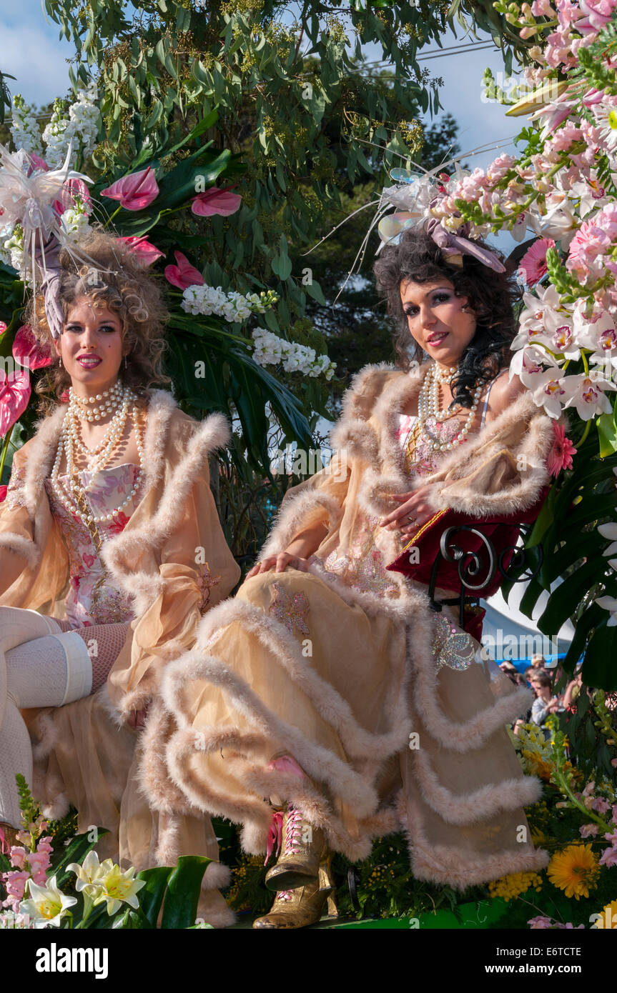 Nice, France, Women in Costume, Throwing Flowers to Crowd on Street at Traditional Spring Carnival parade Stock Photo