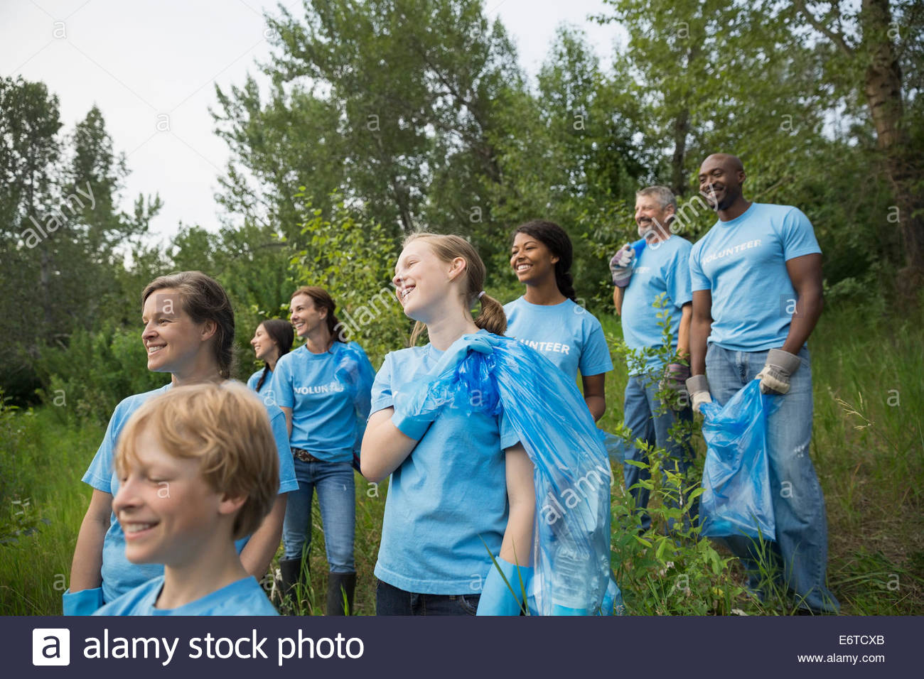 Man Carrying Garbage Bags Stock Photos & Man Carrying Garbage Bags