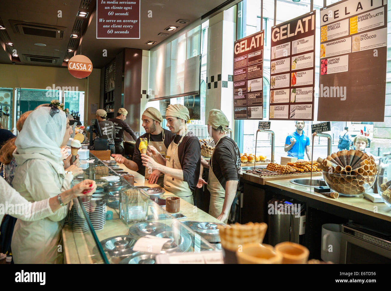 Gelato, Ice cream, shop with staff and customers in Milan, Italy Stock Photo