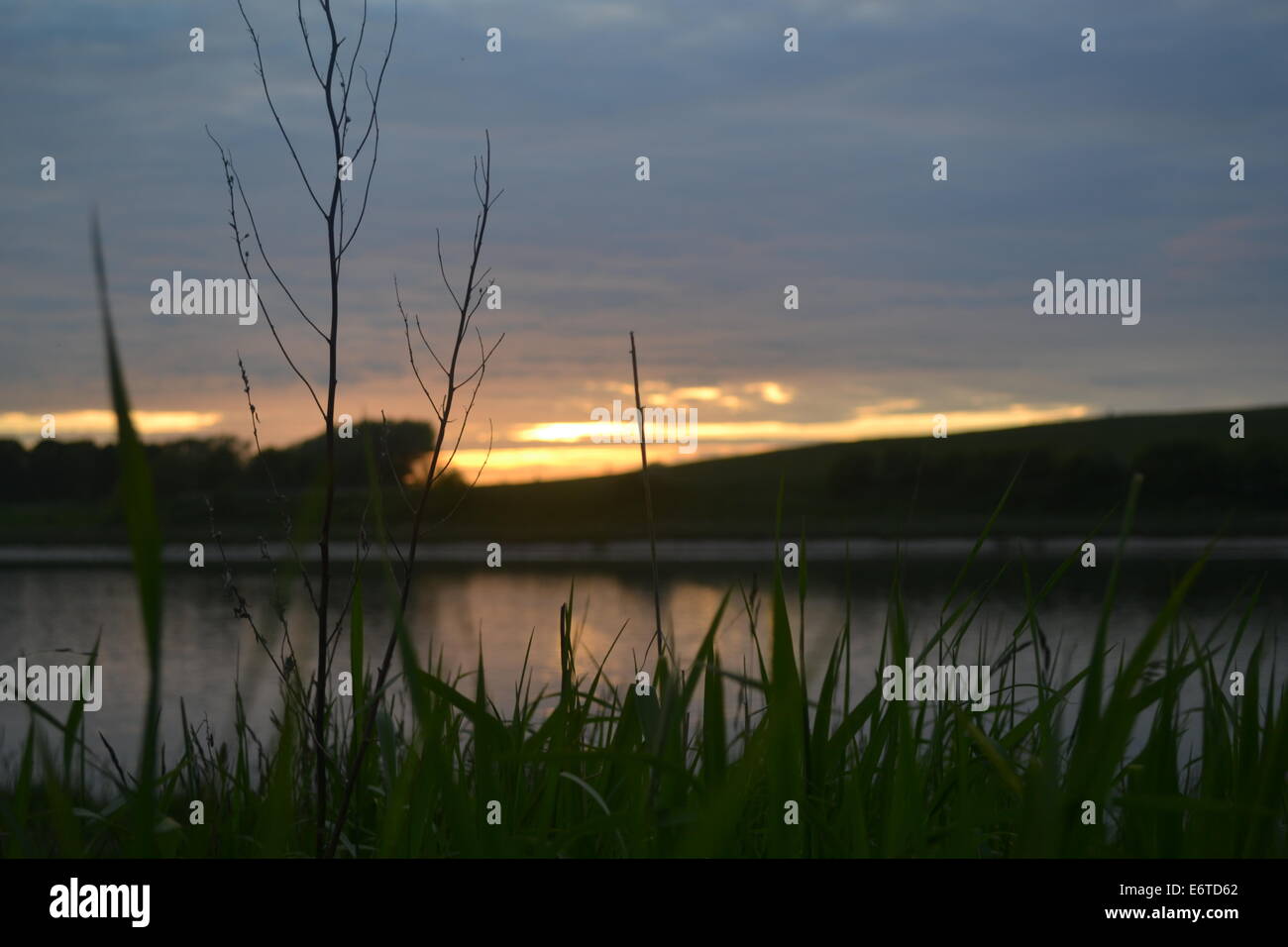 River bank of the Lune at sunset, Lancaster, UK.. Stock Photo
