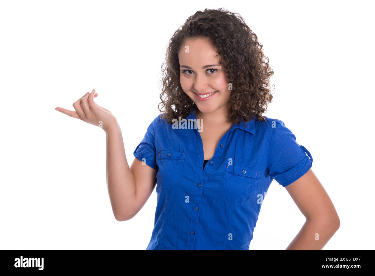 Presentation concept: isolated young woman in blue blouse showing something with forefinger. Stock Photo