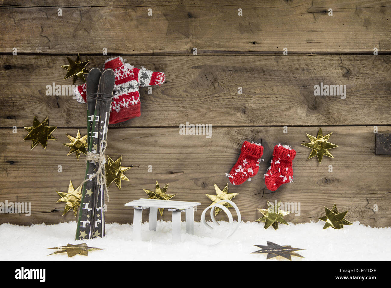 Christmas wooden background with a skiing concept for traveling in winter times. Stock Photo