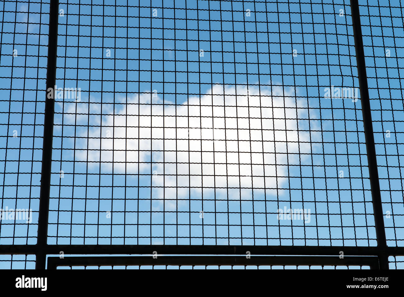 Metal mesh wire fence with blue sky and cloud background Stock Photo ...