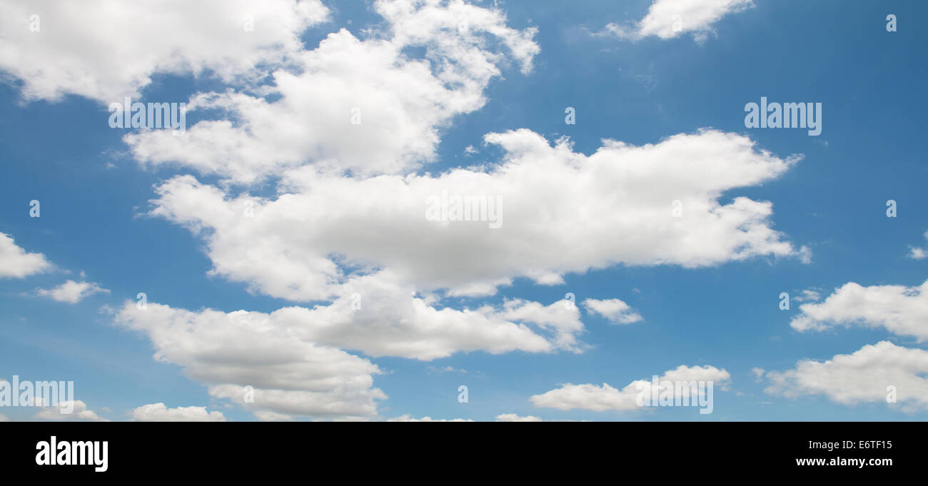 The blue sky and white fluffy clouds Stock Photo - Alamy