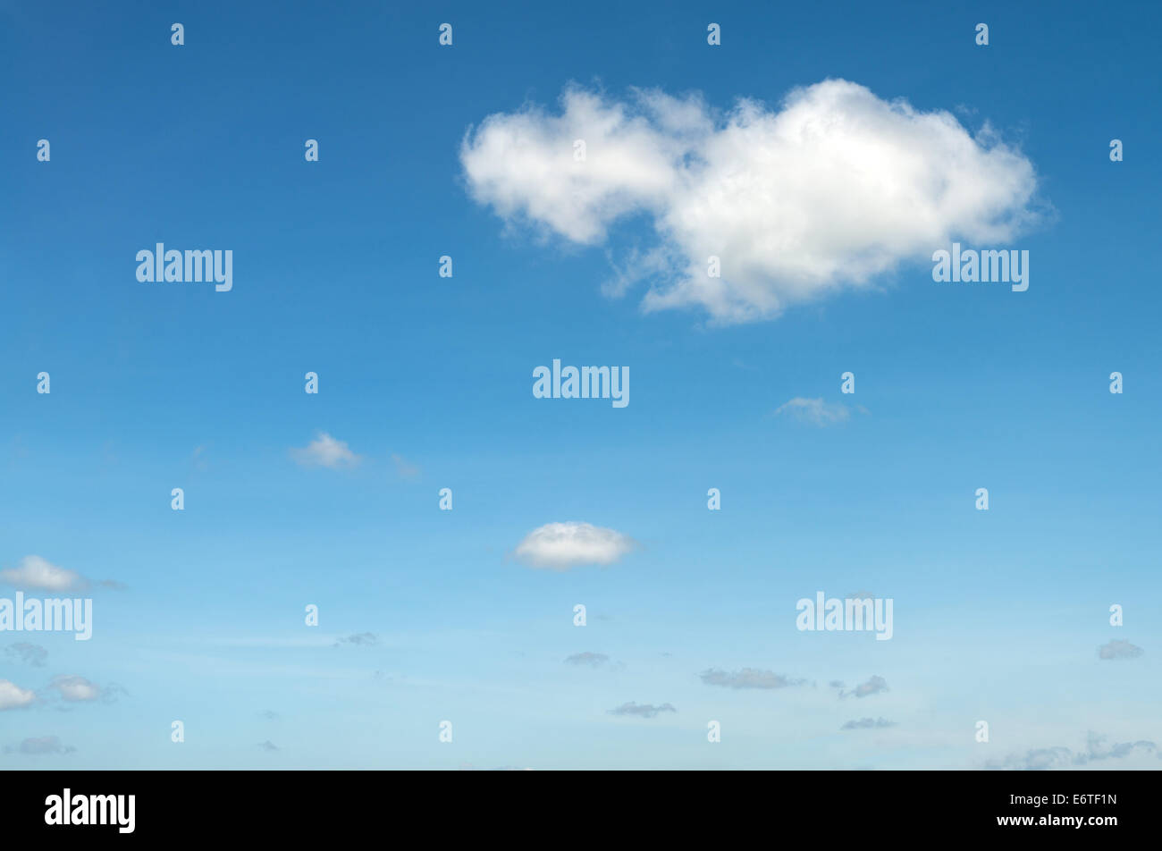 The blue sky and white fluffy clouds Stock Photo - Alamy