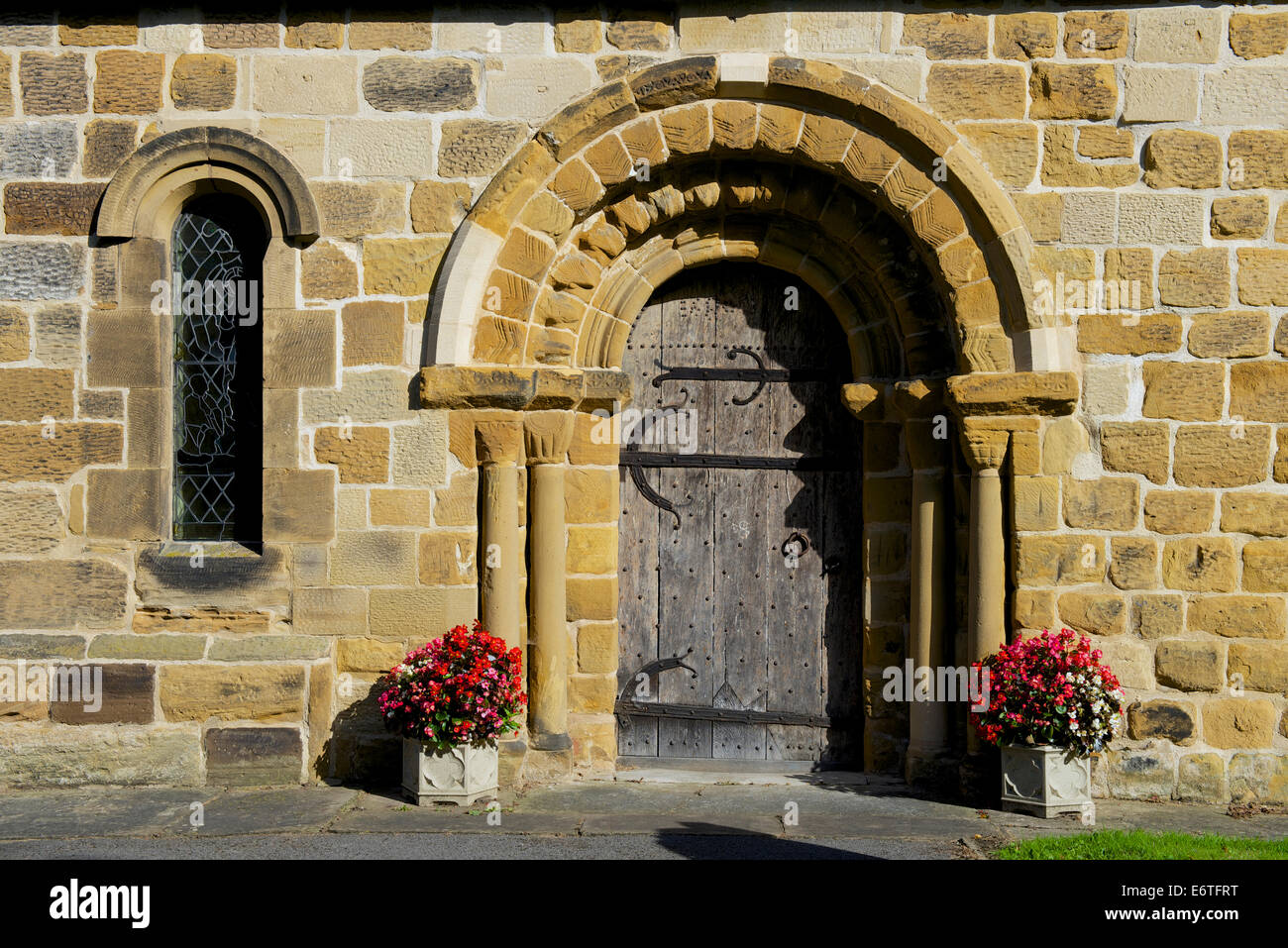 Norman doorway of St Oswalds's Church, Sowerby, near Thirsk, North Yorkshire, England UK Stock Photo