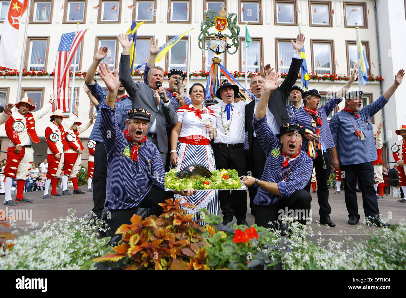 Germany. 30th Aug, 2014. The Lord Mayor of Worms, Michael Kissel (left), the BojemŠŠschter vun de FischerwŠŠd (Mayor of the fishermen's lea), Markus Trapp (2nd right), his bride Natascha Schlereth (2nd left) and the Secretary of State of the Ministry of the Interior of Rhineland-Palatinate, GŸnter Kern (right) wave at the crowd. The Backfischfest started in Worms with the traditional handing over of power from the Lord Mayor to the Mayor of the FishermenÕs Lea. It is the largest wine fair along the Rhine that includes music and dances. Credit:  Michael Debets/Pacific Press/Alamy Live News Stock Photo