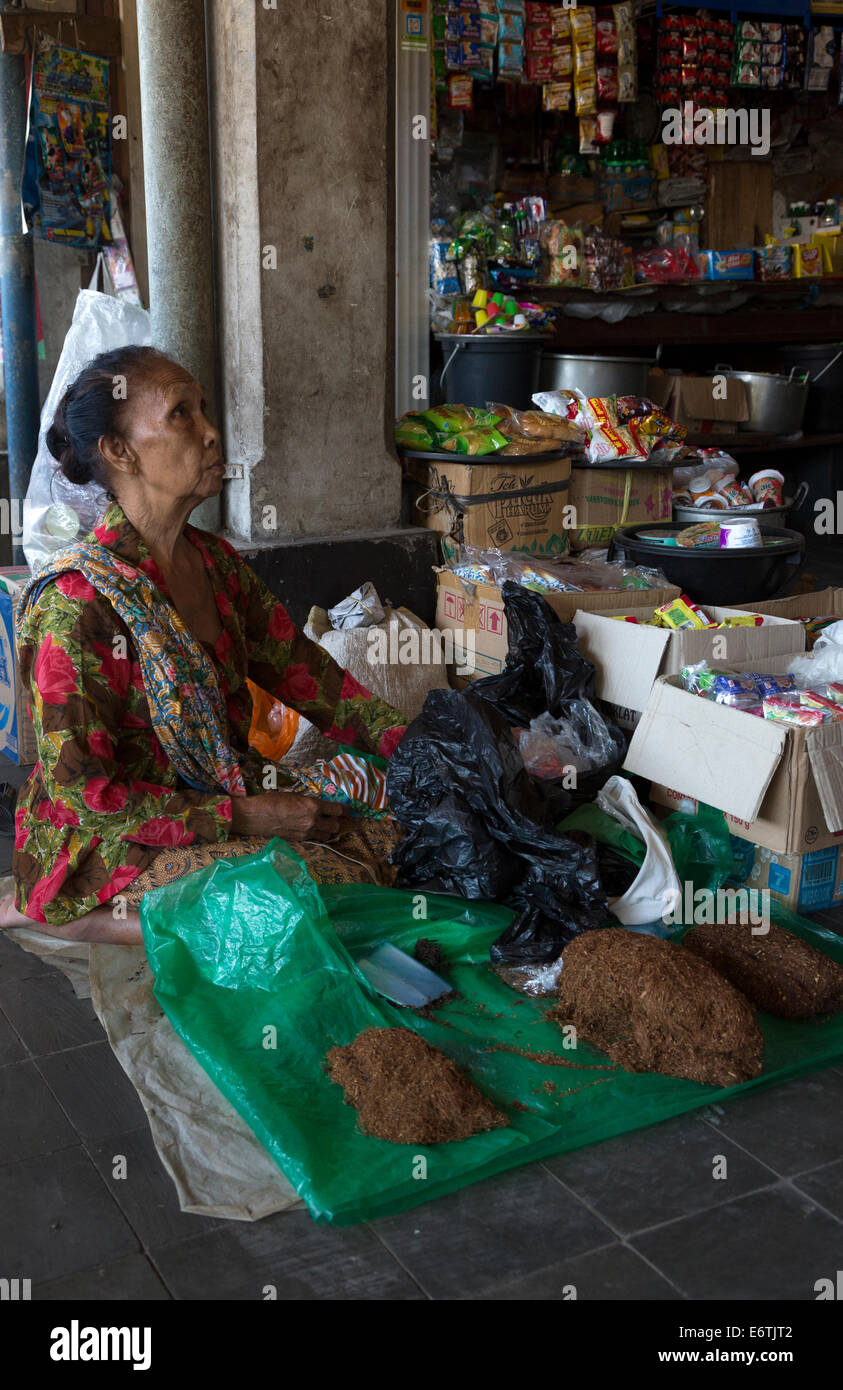 Yogyakarta, Java, Indonesia.  Woman Selling Tobacco, Beringharjo Market. Stock Photo
