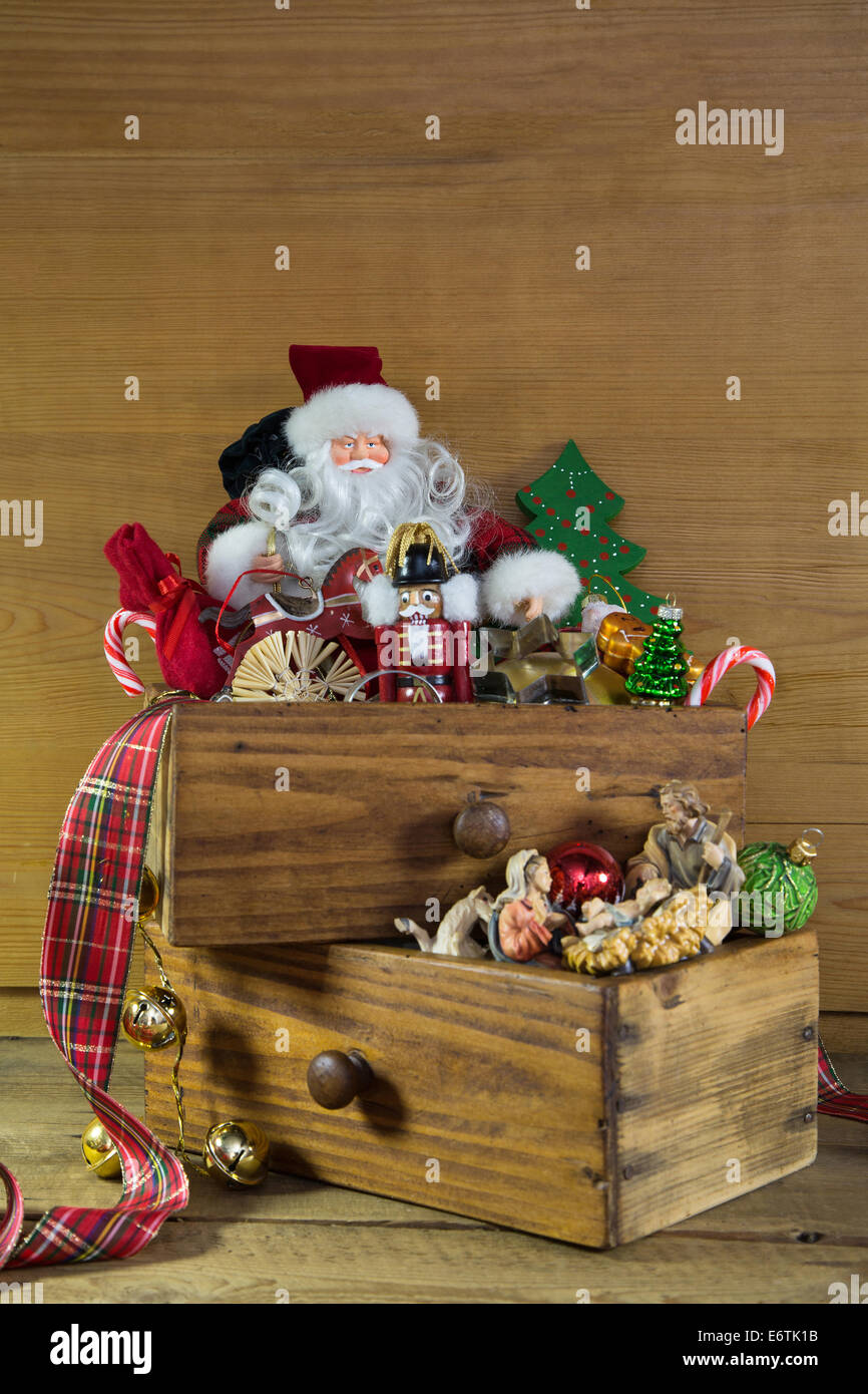 Old christmas toys: vintage decoration idea for advent on wooden background with a Santa. Stock Photo