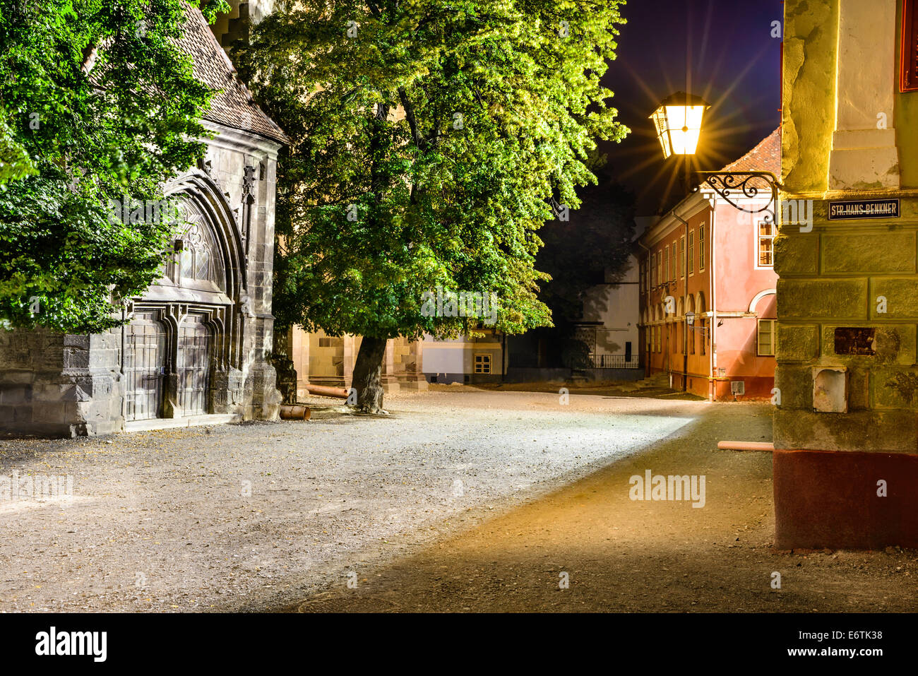Night scene in Black Church Square, medieval downtown of Brasov, Transylvania in Romania. Stock Photo