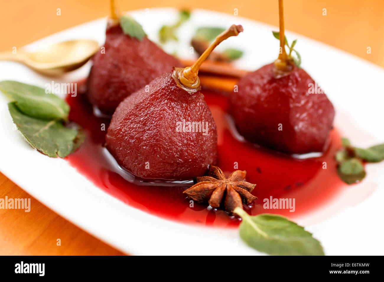 fruity dessert, rears in red wine with spices Stock Photo