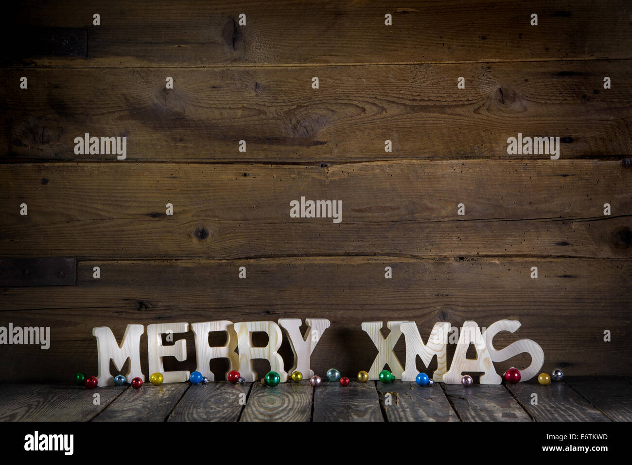 Merry christmas text on wooden old rustic background. Stock Photo