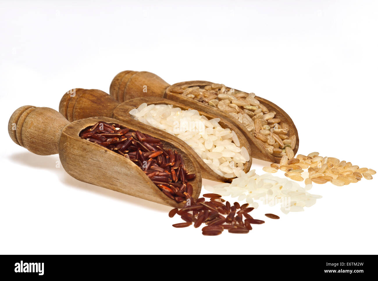 Slops Food Rice Wooden scoops with different rice types scattered on white background ...