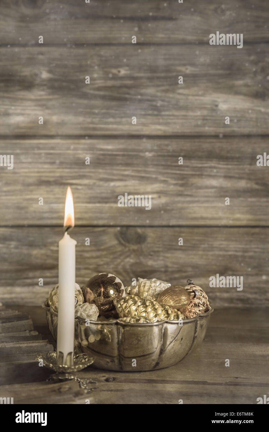 One white burning advent candle on wooden christmas background. Stock Photo