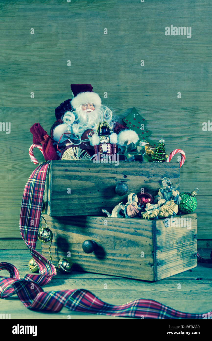 Santa Claus with gifts for christmas decoration on wood. Stock Photo