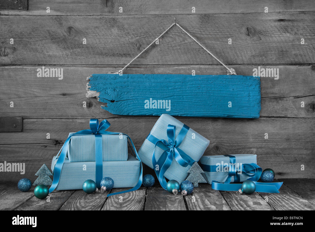 Background: Christmas voucher or coupon with gifts in turquoise blue. Stock Photo