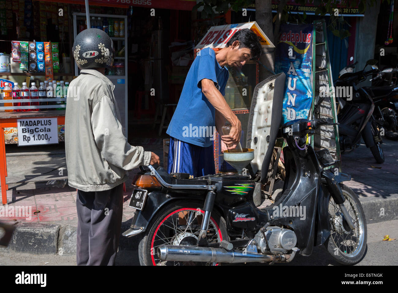 Yogyakarta, Java, Indonesia.  Buying Gasoline by the Liter. Stock Photo