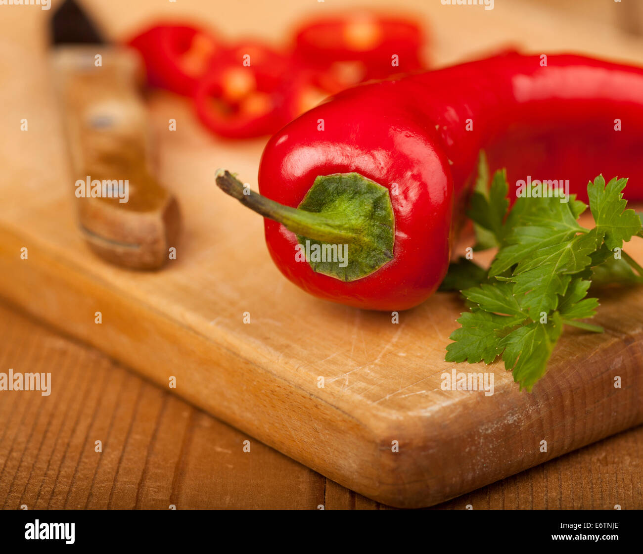 Red Hot Chili Peppers on a cutting board and wooden background Stock ...