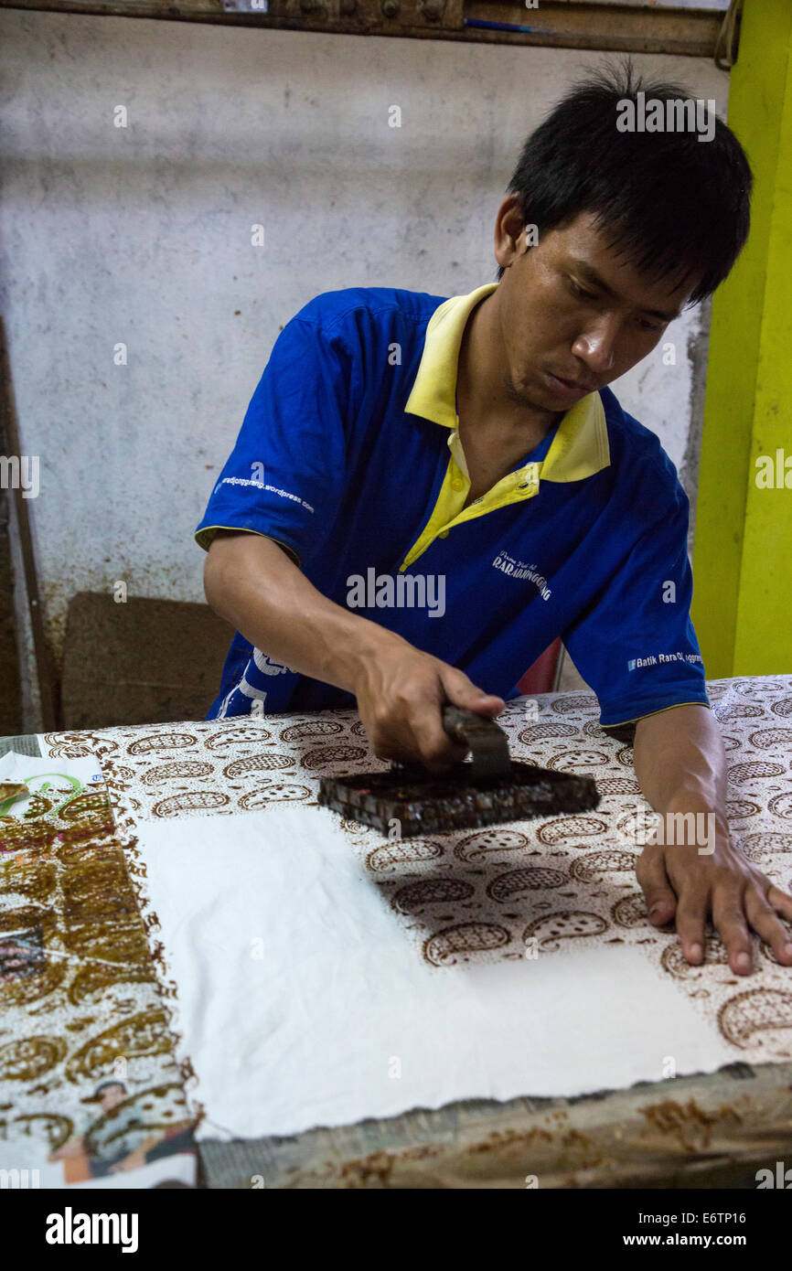 Yogyakarta, Java, Indonesia. Batik Workshop. Male Worker Applying Block