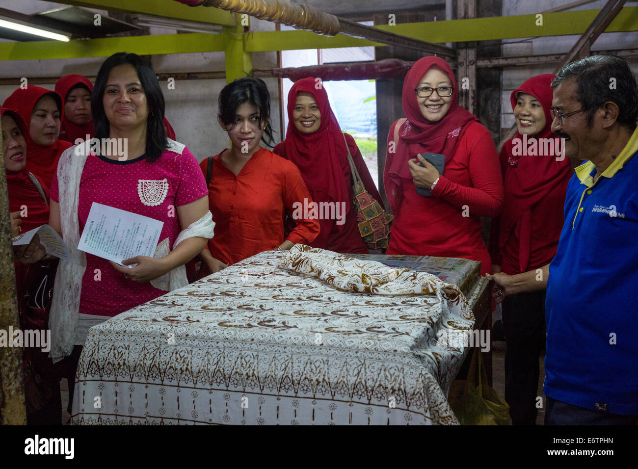 Yogyakarta, Java, Indonesia.  Women's Group Visiting Batik Workshop. Stock Photo
