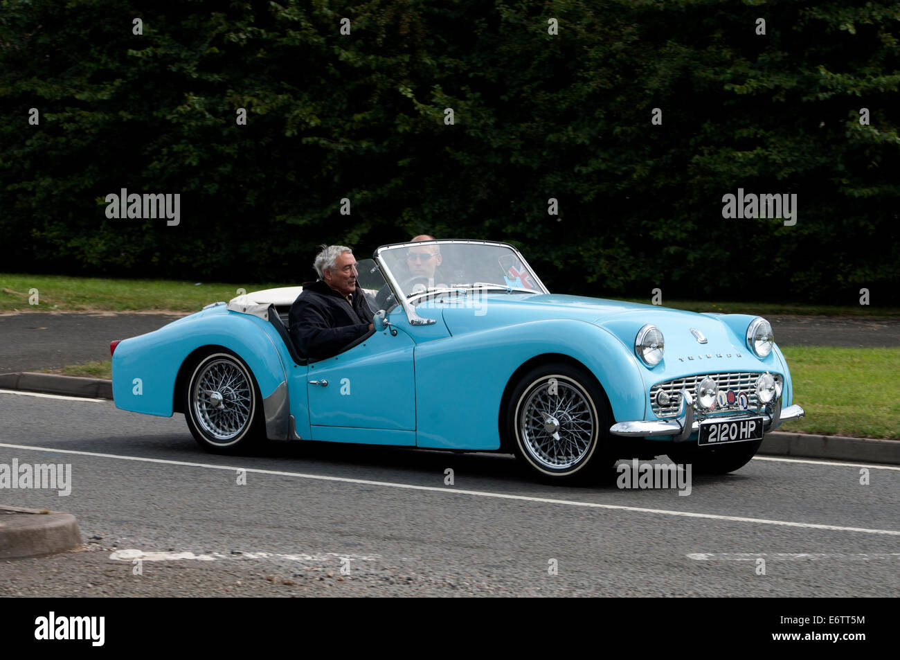 1960 Triumph  TR3A car on the Fosse Way road, Warwickshire, UK Stock Photo