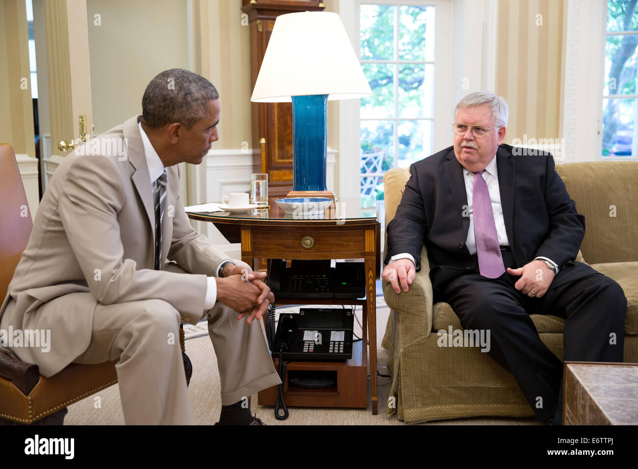 US President Barack Obama meets with U.S. Ambassador to Russia, John F. Tefft, in the Oval Office of the White House to discuss the situation in Ukraine August 28, 2014 in Washington, DC. Stock Photo