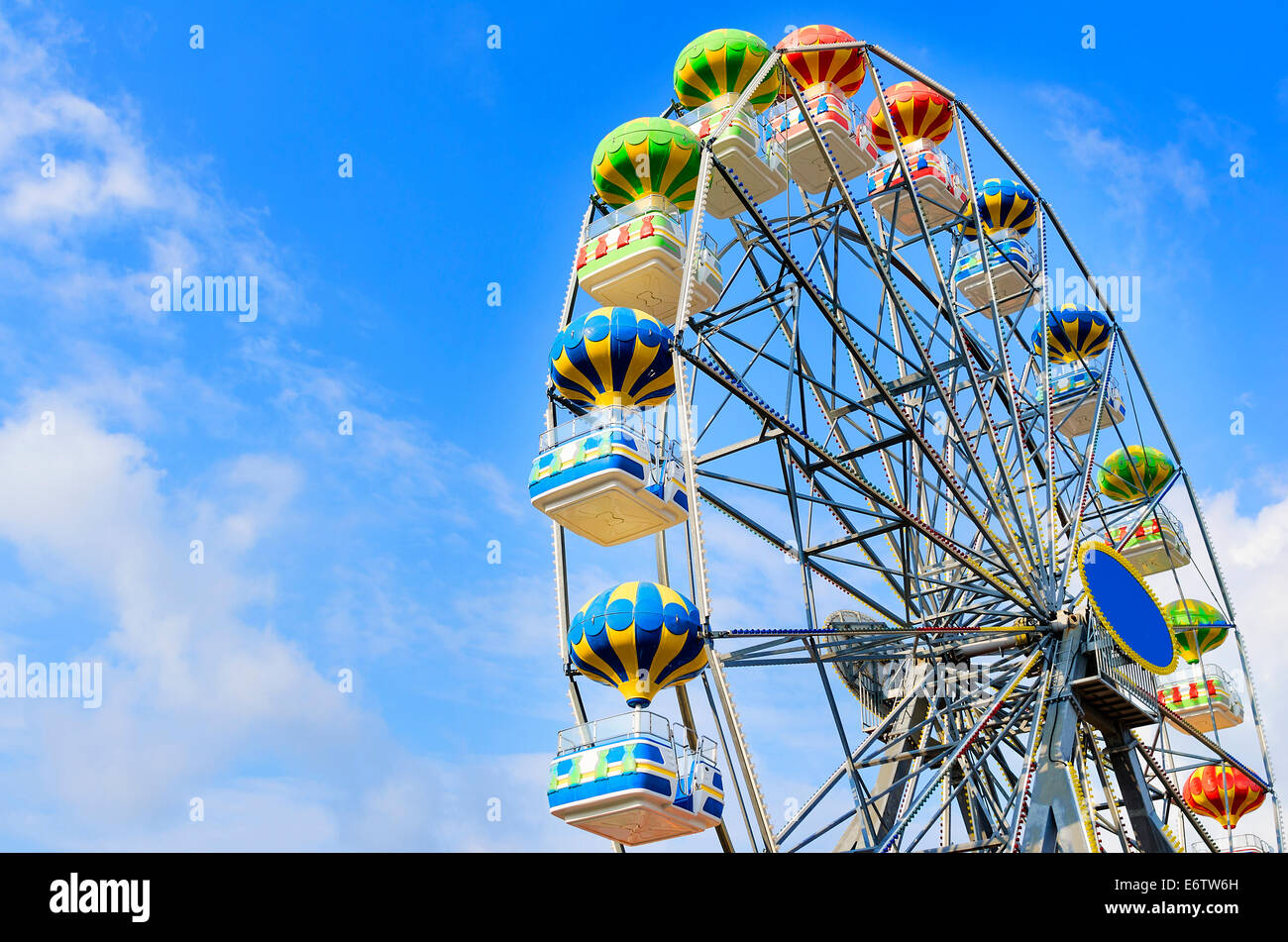 Ferris wheel on the background of blue sky with cloud Stock Photo - Alamy