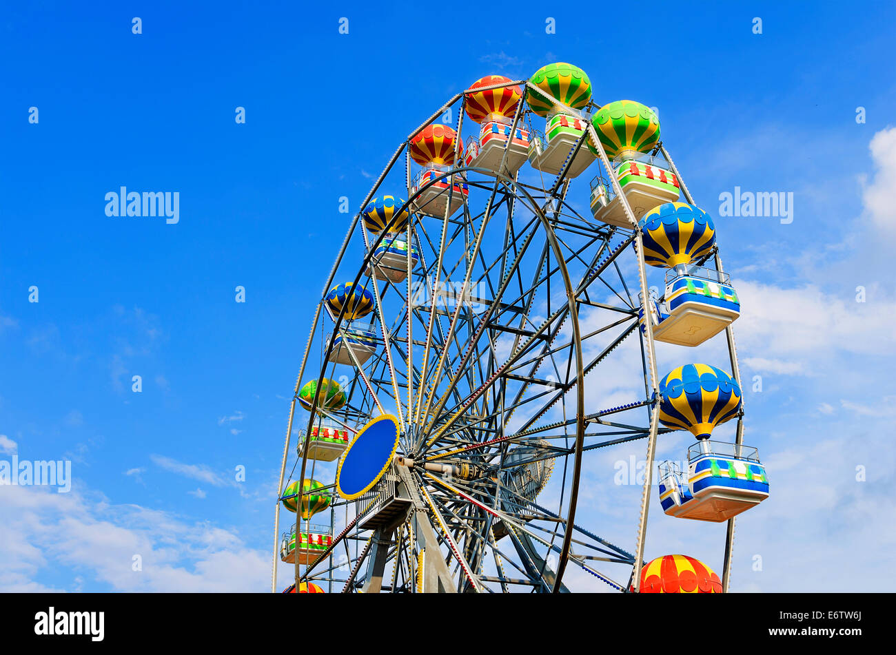 Ferris wheel on the background of blue sky with cloud Stock Photo - Alamy