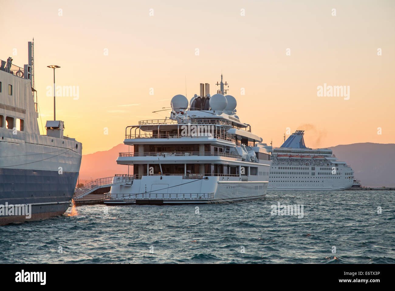 Luxury large super or mega motor yacht in the evening on sunset. Stock Photo