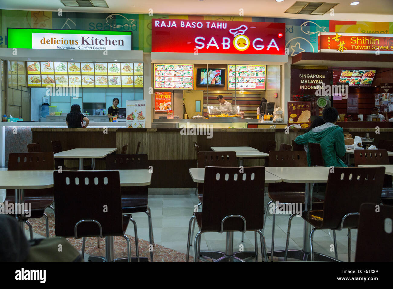 Yogyakarta, Java, Indonesia.  Ambarrukmo Shopping Mall, Restaurants in the Food Court. Stock Photo
