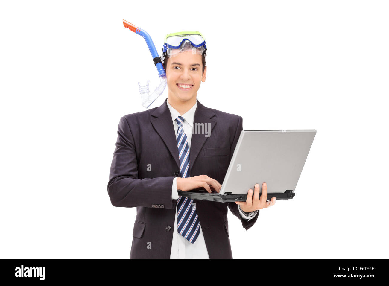 Businessman with diving equipment holding laptop isolated on white background Stock Photo