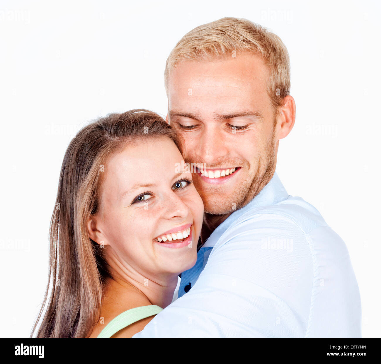 Portrait of a Happy Young Couple Smiling Looking - Isolated on White Stock Photo