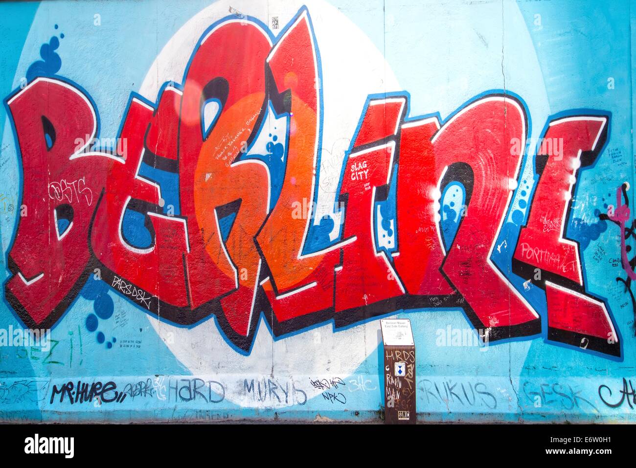 BERLIN - AUGUST 24, 2014 : The East Side Gallery is the largest outdoor art gallery in the world. This piece of the wall shows a graffiti of the letters of Berlin Stock Photo