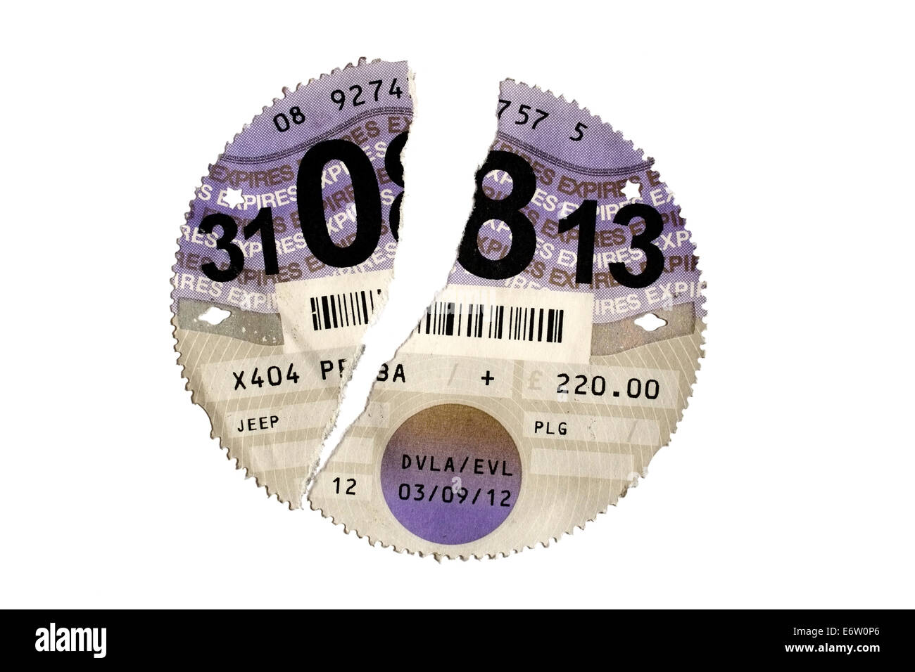 expired paper car tax disc torn in half Stock Photo