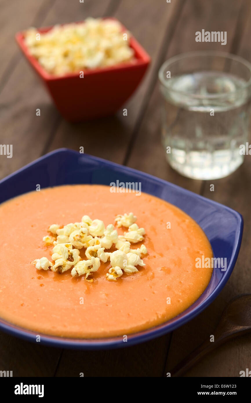 Ecuadorian tomato and potato cream soup served with popcorn on top Stock Photo