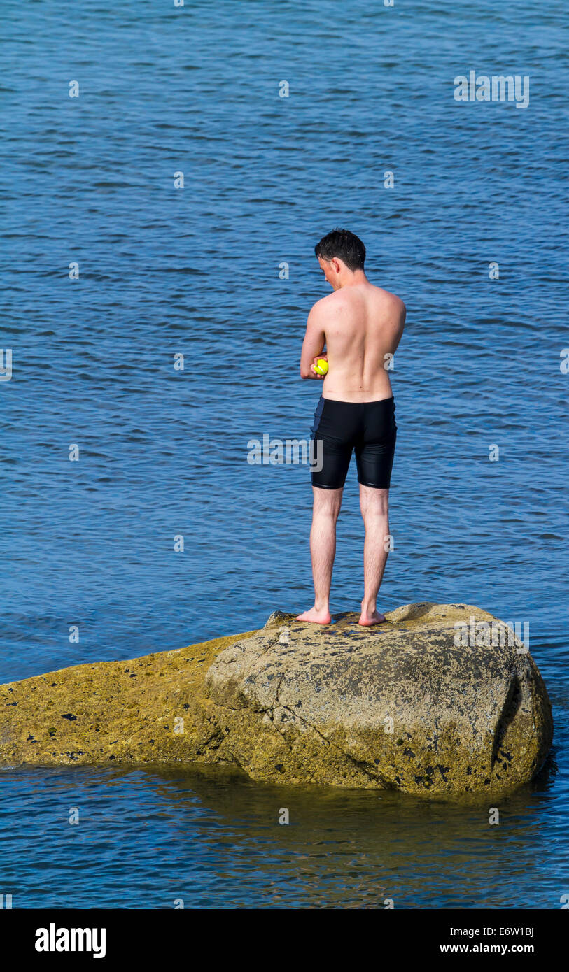 A Young Swimmer on a rock at Portballintrae Harbour County Antrim ...