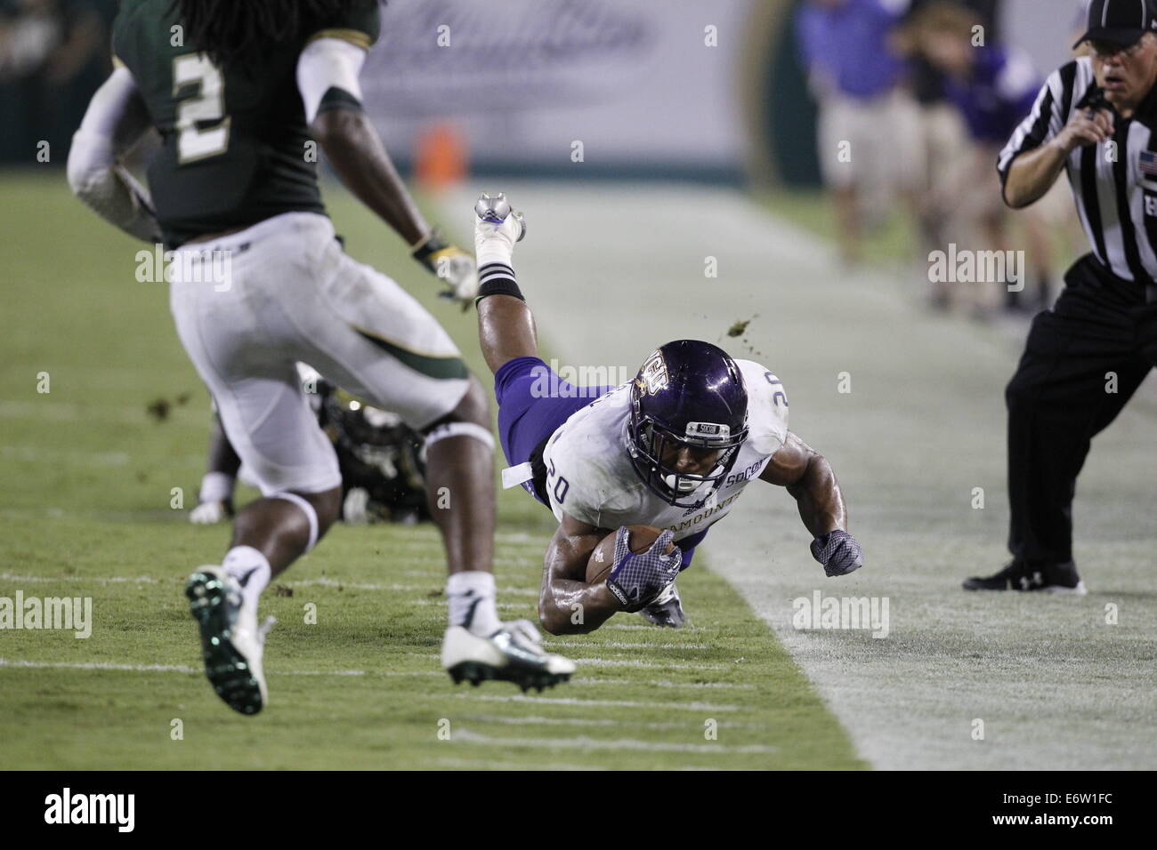 Florida, US. 30th Aug, 2014.Western Carolina running back Darius Ramsey (20) dives for a first down against the South Florida defense in the third quarter at Raymond James Stadium in Tampa, Florida on Saturday, August 30, 2014. South Florida defeated Western Carolina 36 to 31. Credit:  Octavio Jones/Tampa Bay Times/ZUMA Wire/Alamy Live News Stock Photo