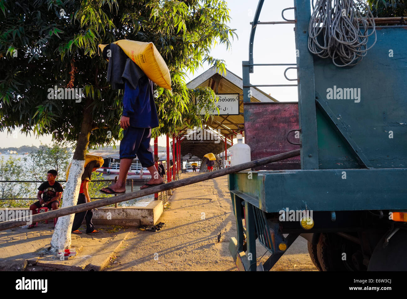 Workers loading at Yangon River, Yangon, Myanmar, Asia Stock Photo