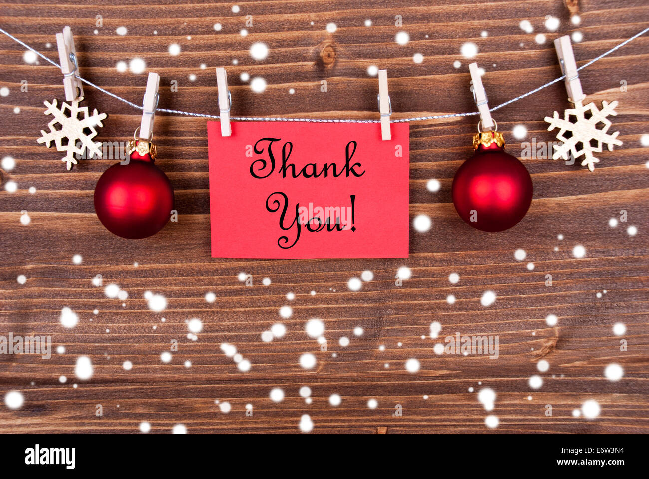 Winter or Christmas Background with the Words Thank You on a Red Label