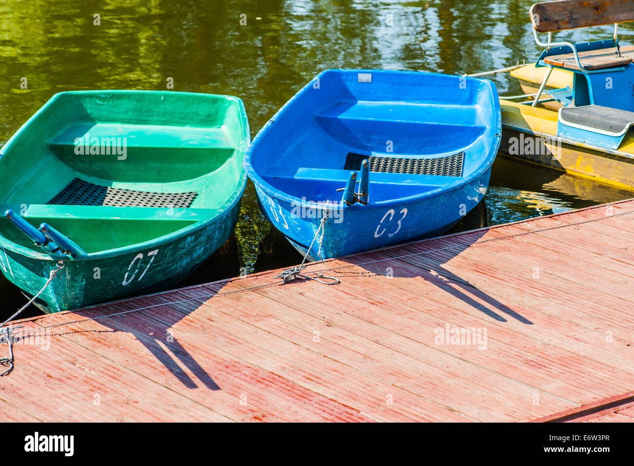 Oar boats and pedal boat for hire wait for clients Stock Photo Alamy
