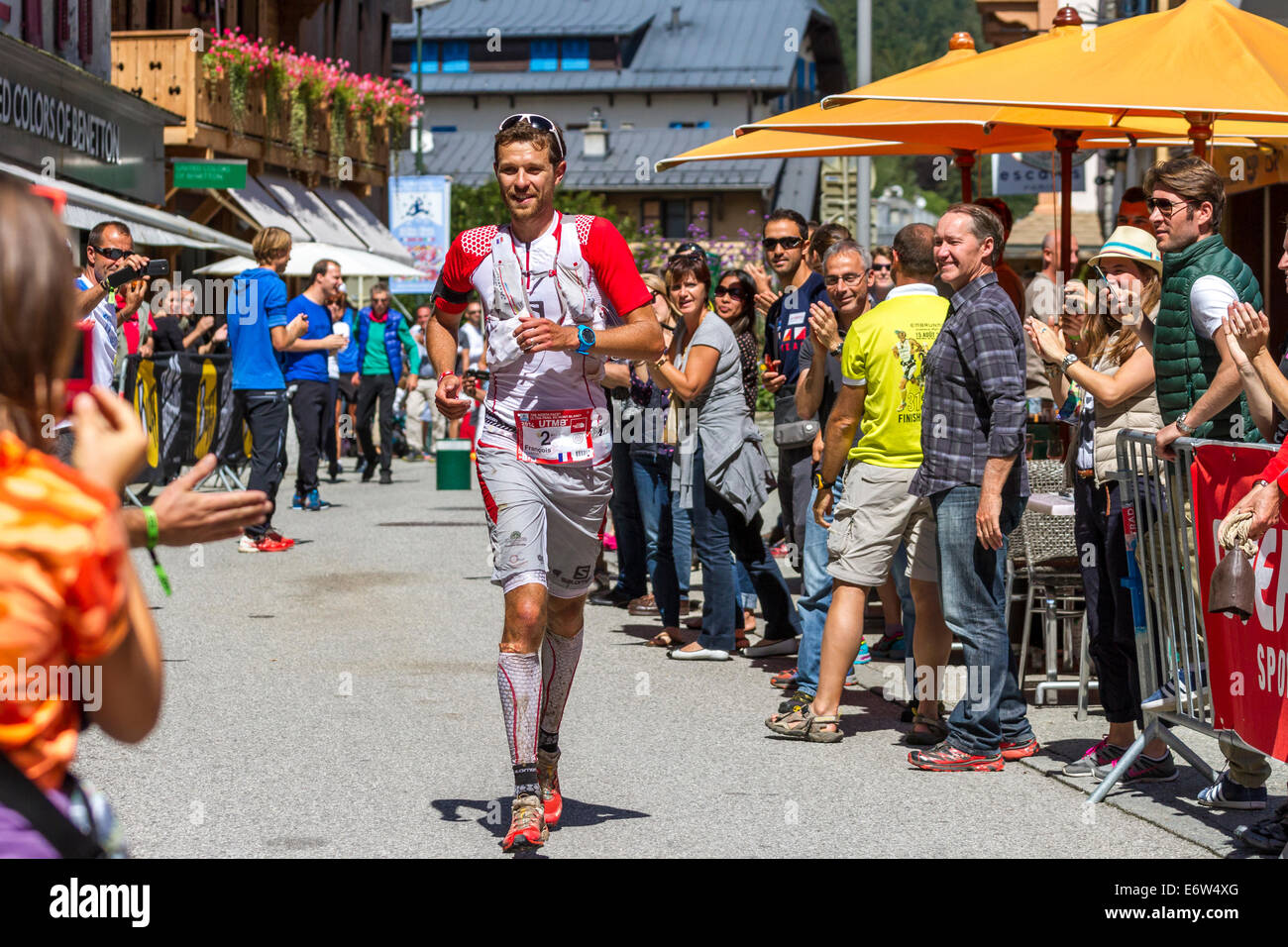 French ultra runner François D'Haene enters Chamonix town centre on his