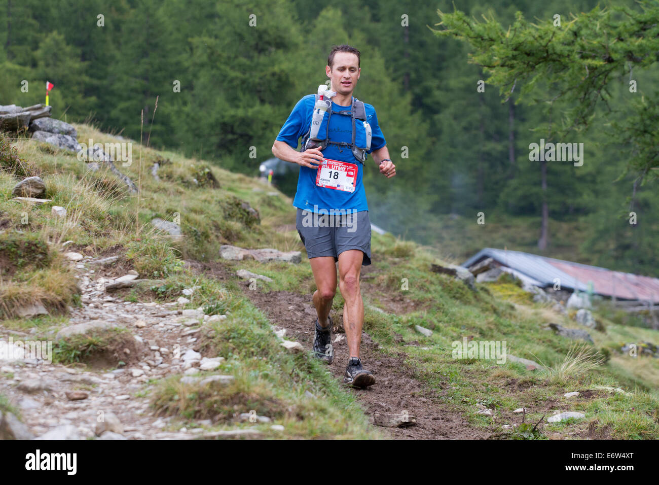 American ultra runner Jason Schlarb passes above the Col de la ...