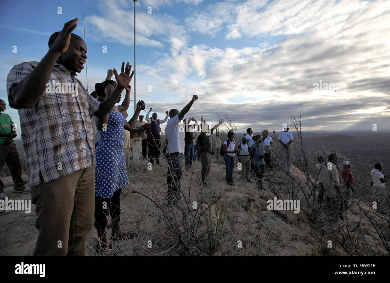 (140831) -- KORA NATIONAL PARK, Aug. 31, 2014 (Xinhua) -- Wildlife conservationists from different countries climb the Kora Rock which was frequented by George Adamson in Kora National Park, in Kenya, Aug. 30, 2014. People gathered here to commemorate the 25th anniversary of the death of George Adamson on Saturday. George Adamson, also known as 'Father of Lions', was a British wildlife conservationist who took care of orphaned lions and later released them to the wild. He and his wife are best known through the movie 'Born Free' and best-selling book with the same title. (Xinhua/Zhou Xiaoxiong Stock Photo